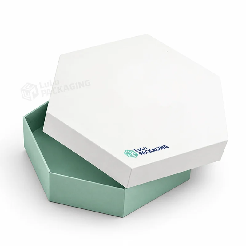 White hexagon rigid box lid resting on a mint green hexagon base, with the LuLu Packaging logo