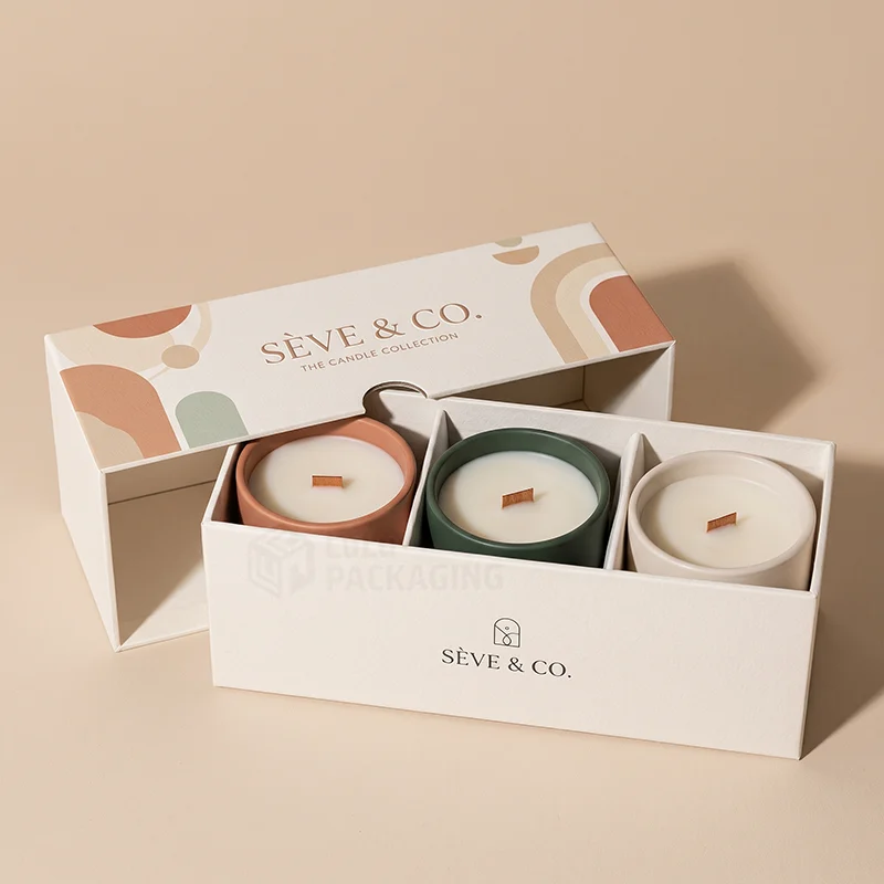 Cream two piece candle gift box with dividers holding three wooden-wick candles