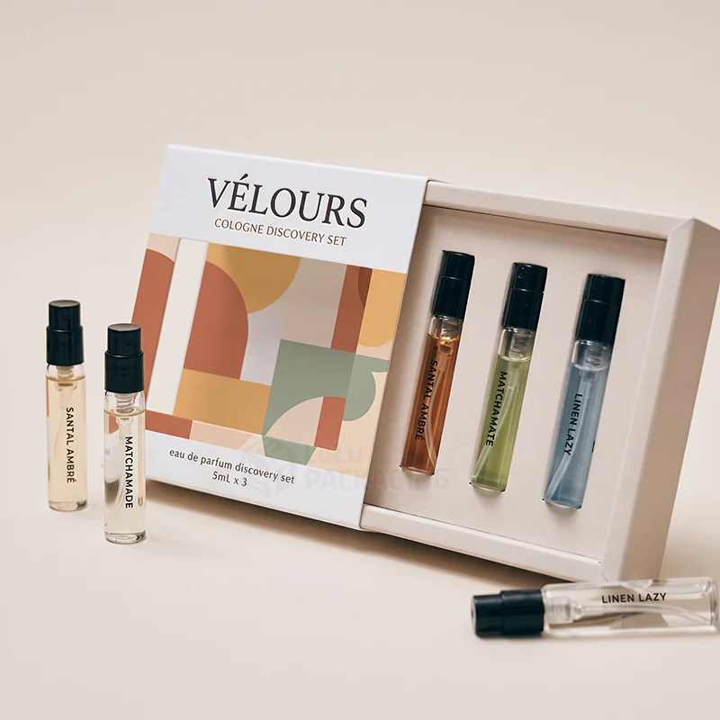 Cologne discovery set box with a printed sleeve and three sample spray vials in a white insert