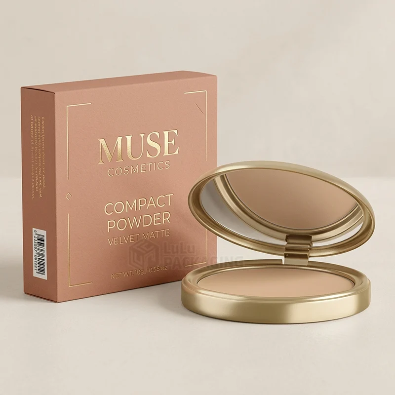 Terracotta compact powder box with gold foil text beside an open gold mirror compact