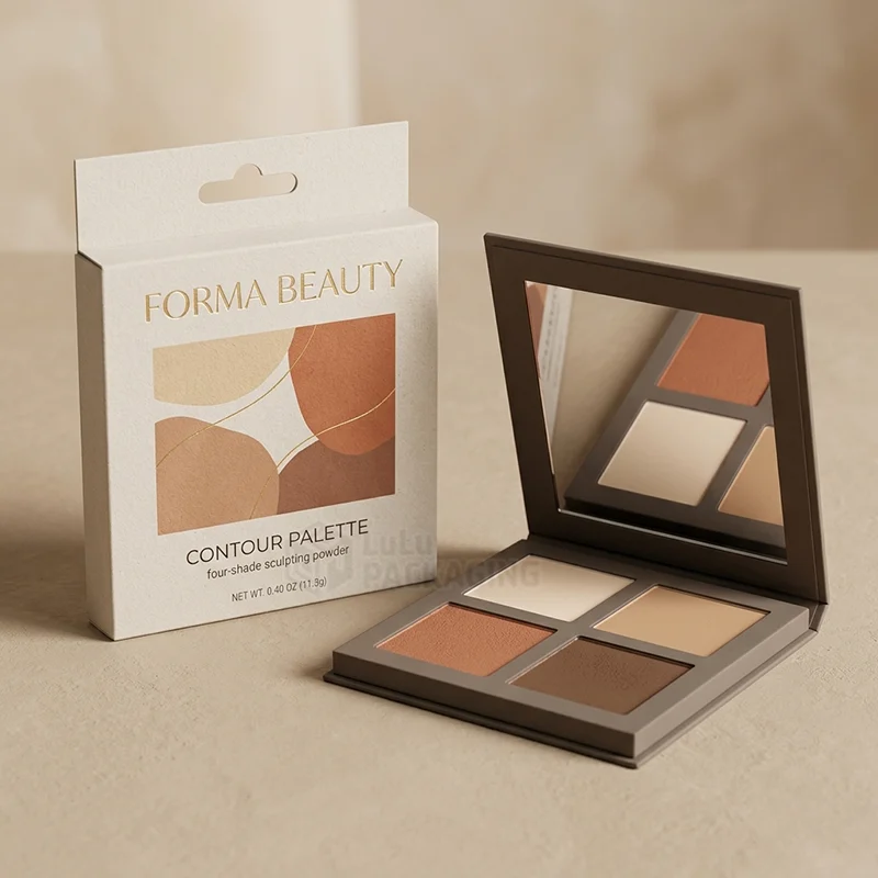 Cream contour palette box with hang tab and gold foil next to an open four pan palette