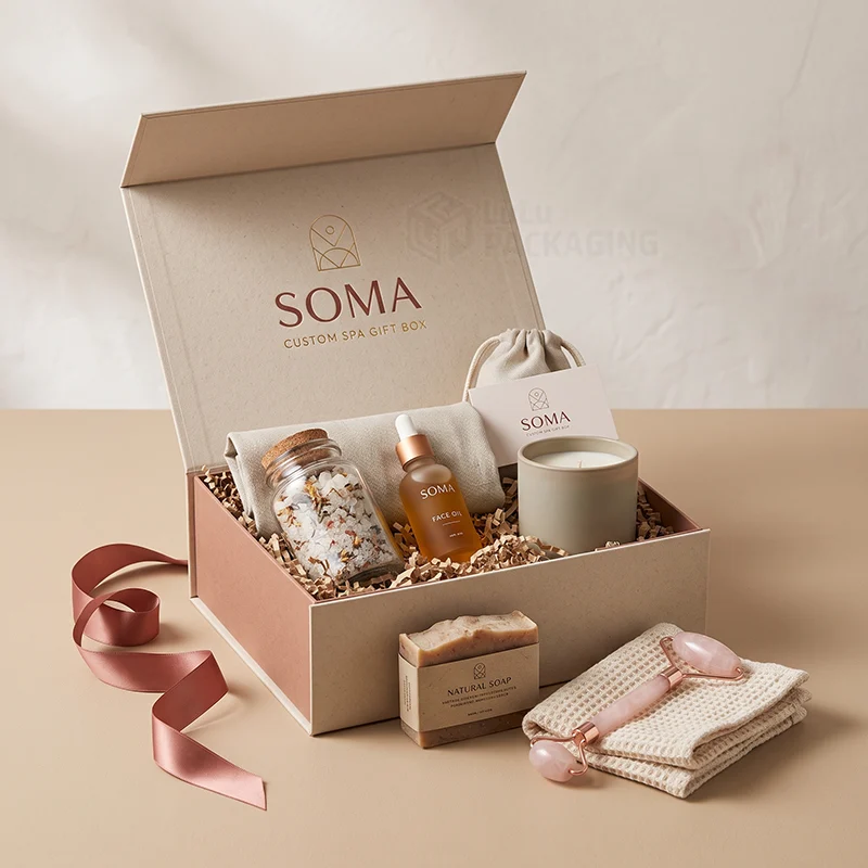 Cream magnetic spa gift box open with bath salts, face oil and candle, soap and roller in front