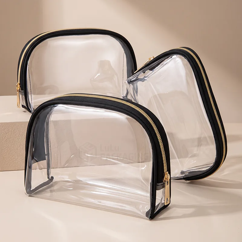 Clear PVC zipper pouches with black trim and gold zippers