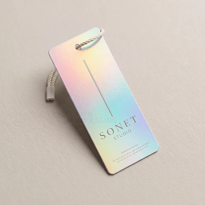 Long rainbow holographic hang tag with a thin rope cord and Sonet Studio printed in grey