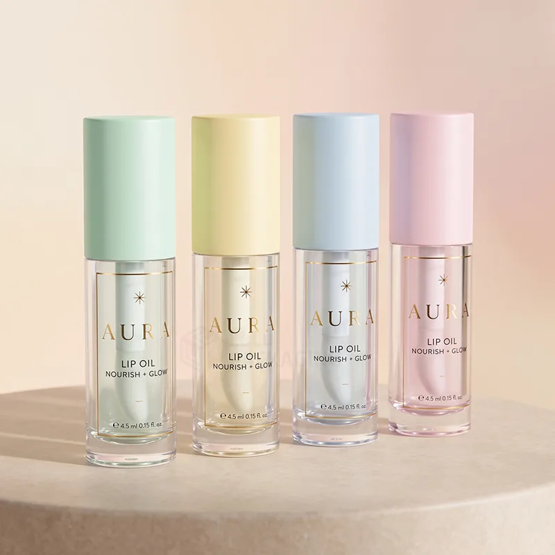 Four clear lip oil tubes with pastel green, yellow, blue and pink caps