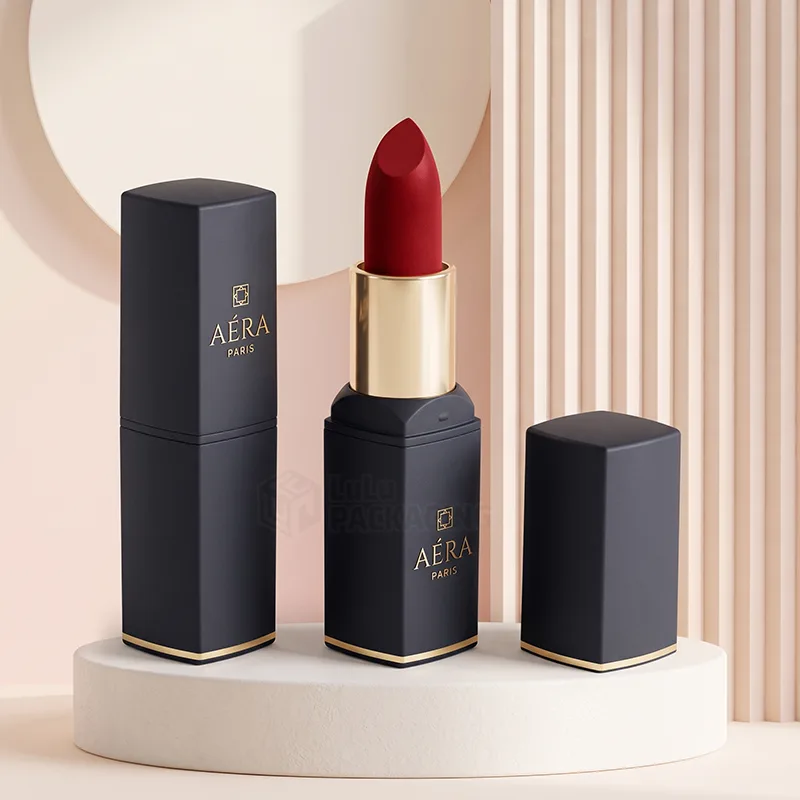 Matte black square lipstick tubes with gold trim, one open showing a red lipstick