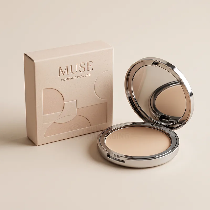 Round silver compact powder case open with a mirror, beside its printed box