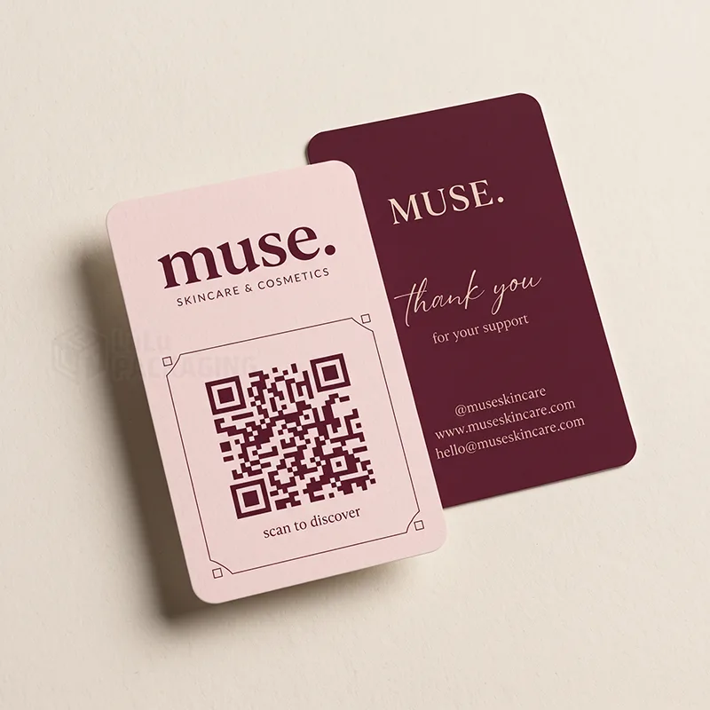 Rounded pink QR code card with 'scan to discover' and a plum thank you card on the reverse