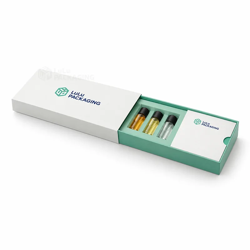 White sleeve sample kit box with mint tray holding three mini vials and a printed card