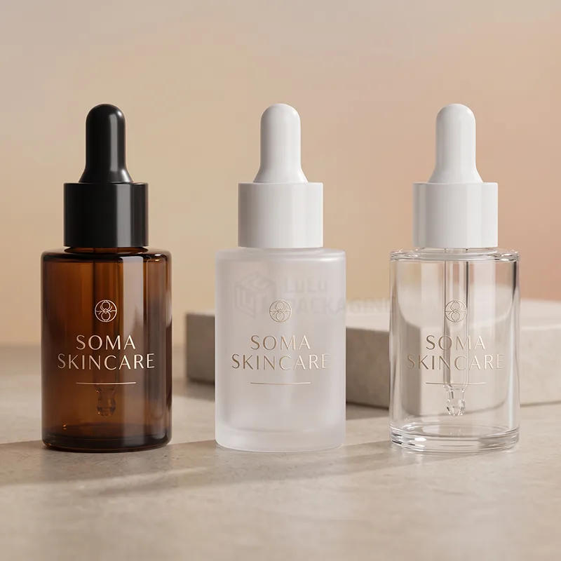 Amber, frosted and clear glass serum bottles with black and white droppers and gold logos