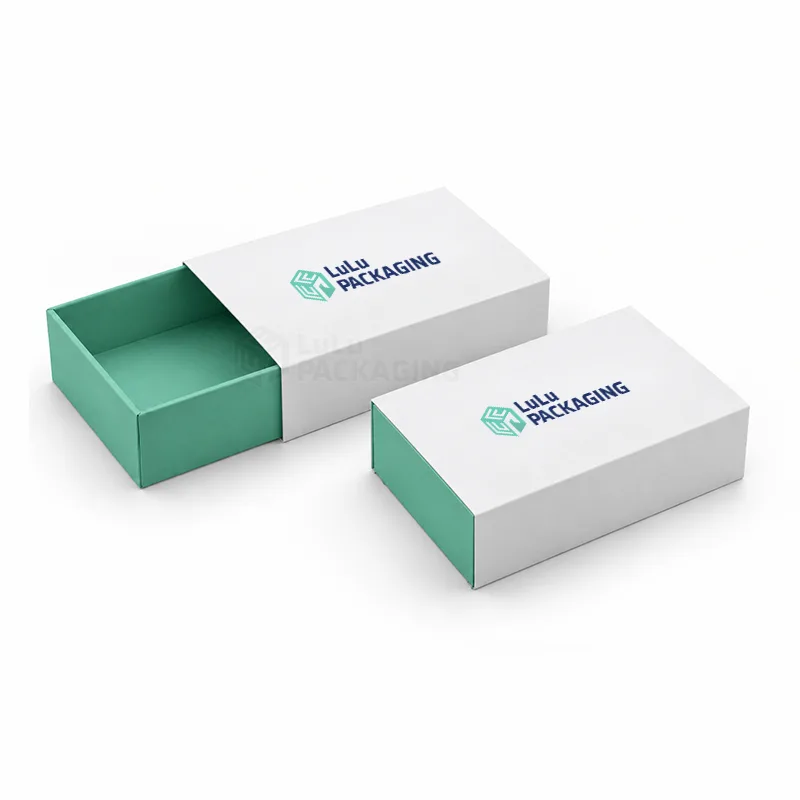 Two white printed sleeve boxes with mint trays, one tray slid half out of its sleeve