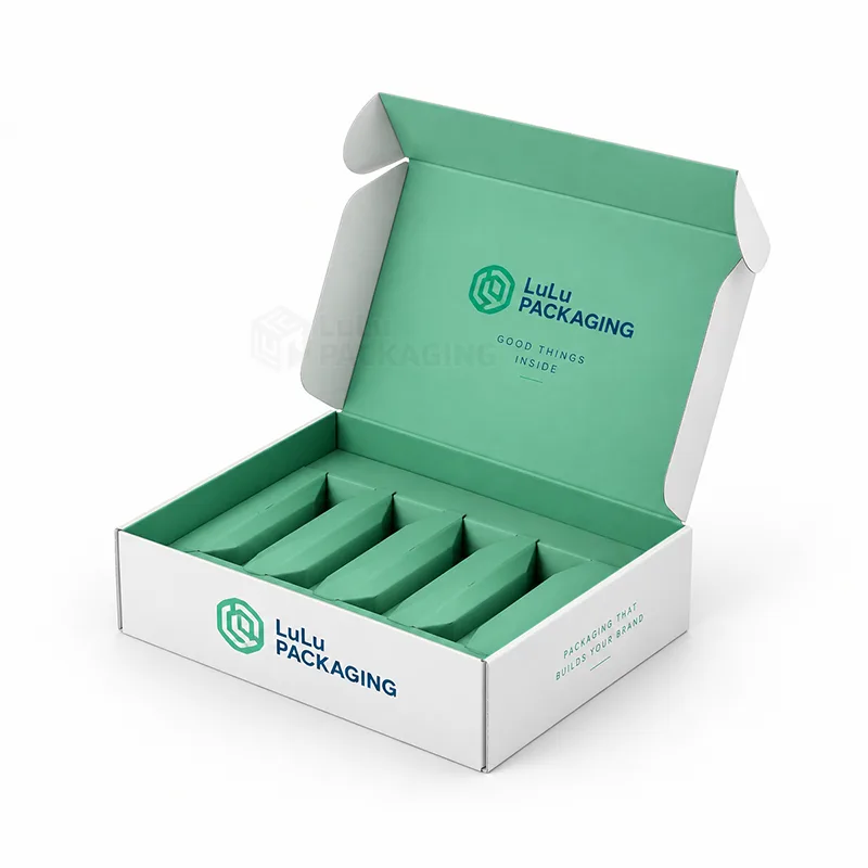 Open white subscription mailer box with mint printed lid and a mint insert with five empty product slots