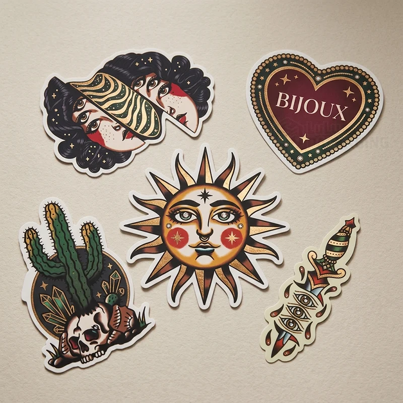Die-cut tattoo-style jewellery stickers with a sun, cactus, dagger and heart design