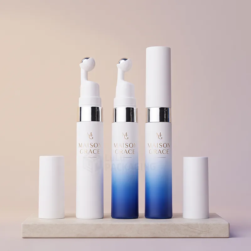 White and blue gradient eye serum bottles with steel roller tips and white caps