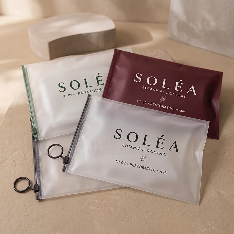 Frosted and burgundy ziplock bags with ring pull slider zippers and printed logos