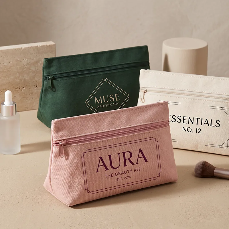 Gusseted canvas zipper pouches in pink, green and natural with printed logos