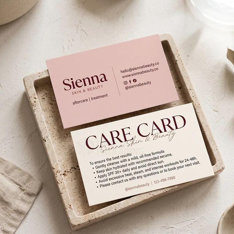Skincare aftercare card with bullet-point steps and a pink contact card on a stone tray