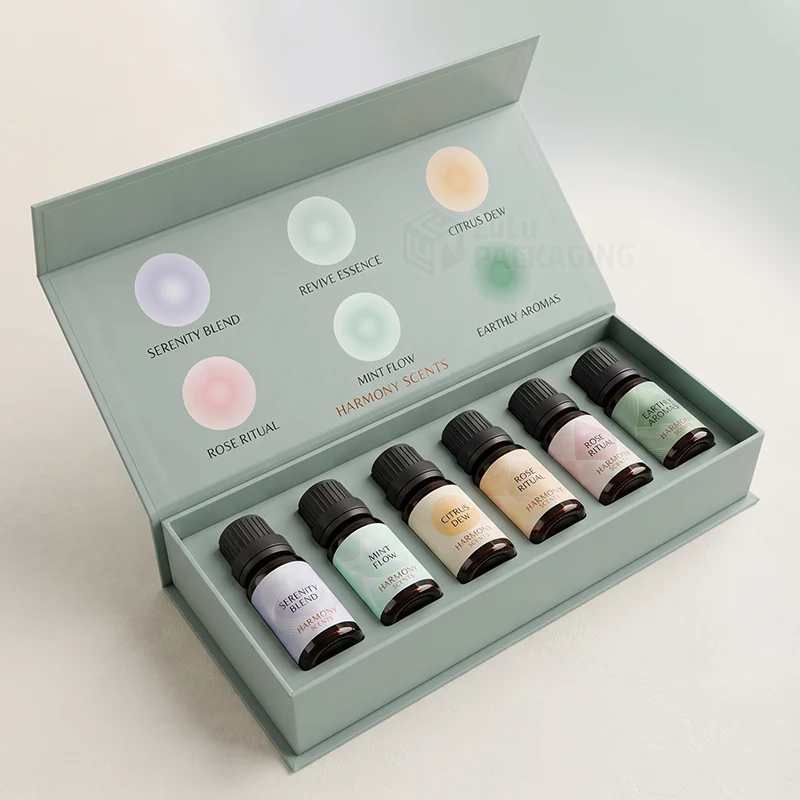Sage magnetic gift box open to show six essential oil dropper bottles in a fitted insert
