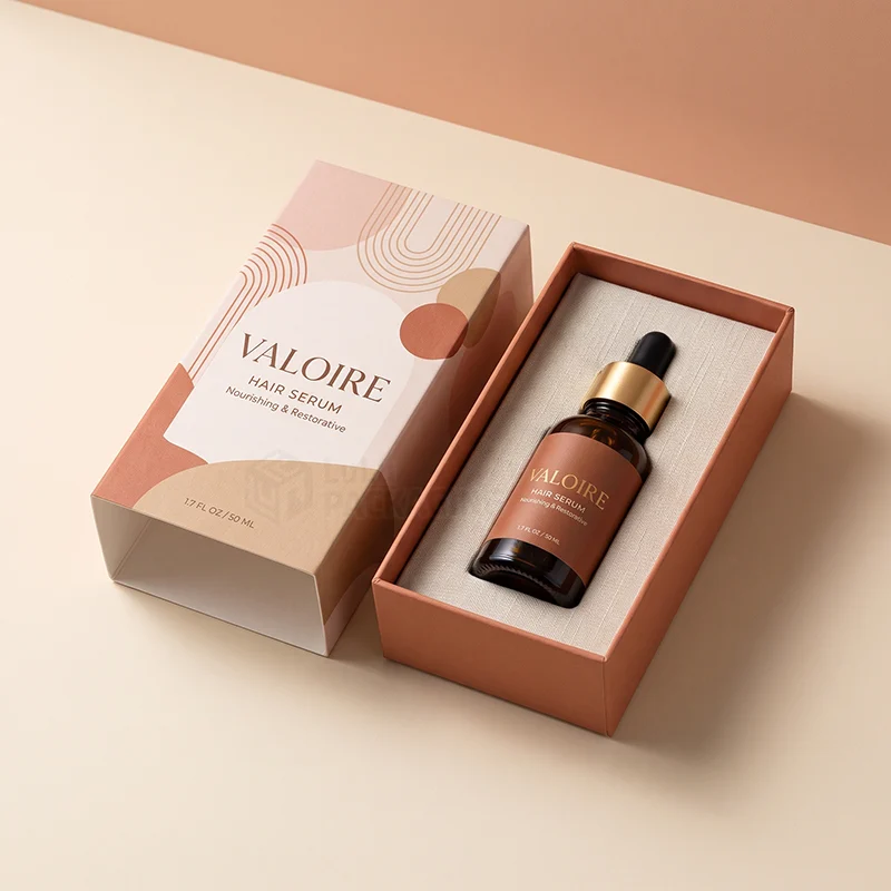 Two piece hair serum box with printed lid and a dropper bottle held in a linen insert