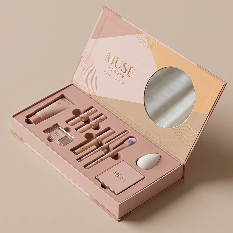 Pink magnetic makeup set box open with a mirror in the lid and products in a die-cut insert