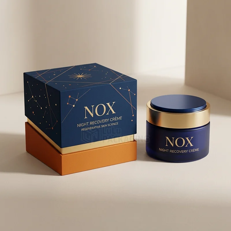 Navy night cream box with gold foil star print and an orange base beside a matching jar