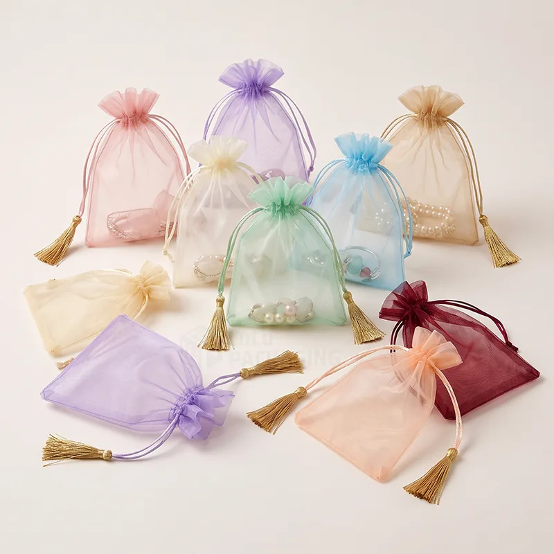 Sheer organza jewellery bags in mixed colours with gold tassel drawstrings and pearls inside