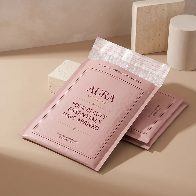Pink bubble mailers with a printed logo and thank you message