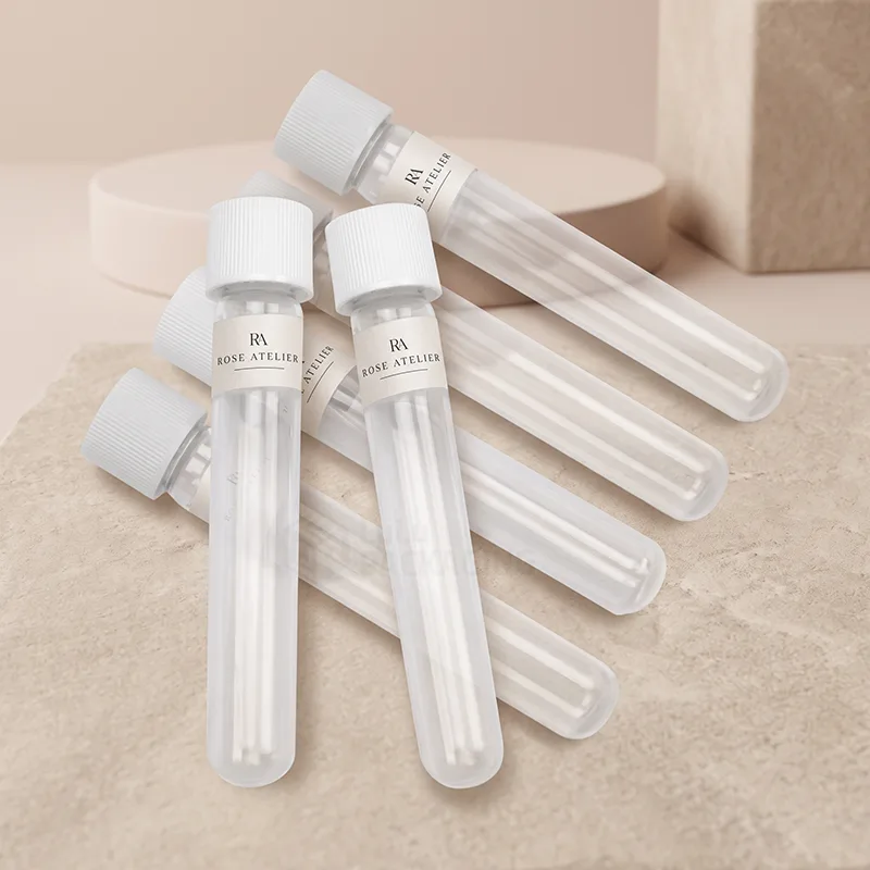 Clear plastic sample tube vials with white screw caps and printed labels