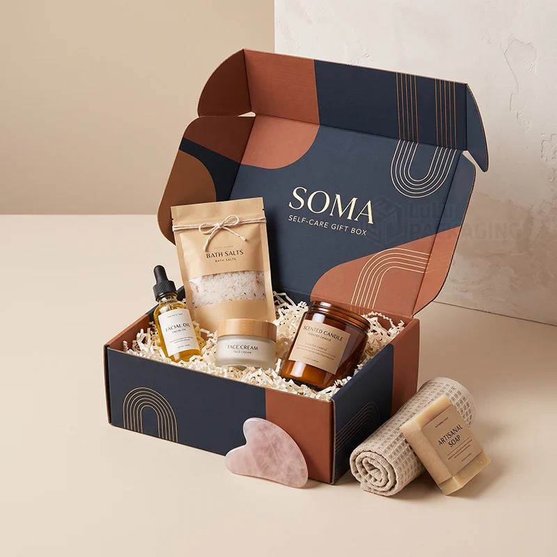 Navy and terracotta self care gift mailer box with bath salts, candle, face cream and oil