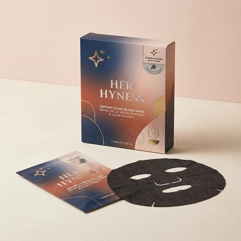 sheet mask boxes with logo in a navy and copper gradient with foil stars
