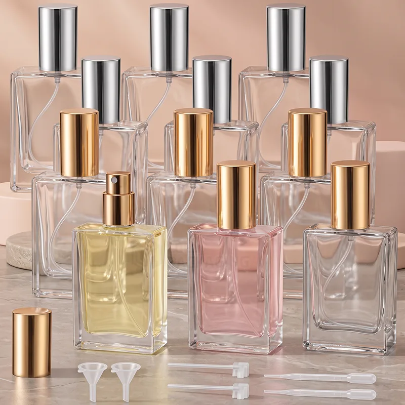 Square clear glass perfume spray bottles with gold and silver caps, funnels and pipettes