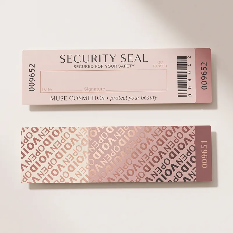 Pink numbered security seal sticker with signature box and barcode, above a second seal showing the VOID OPEN pattern