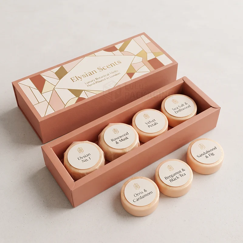 Terracotta wax melt box with a geometric foil sleeve, round labelled melts inside and in front