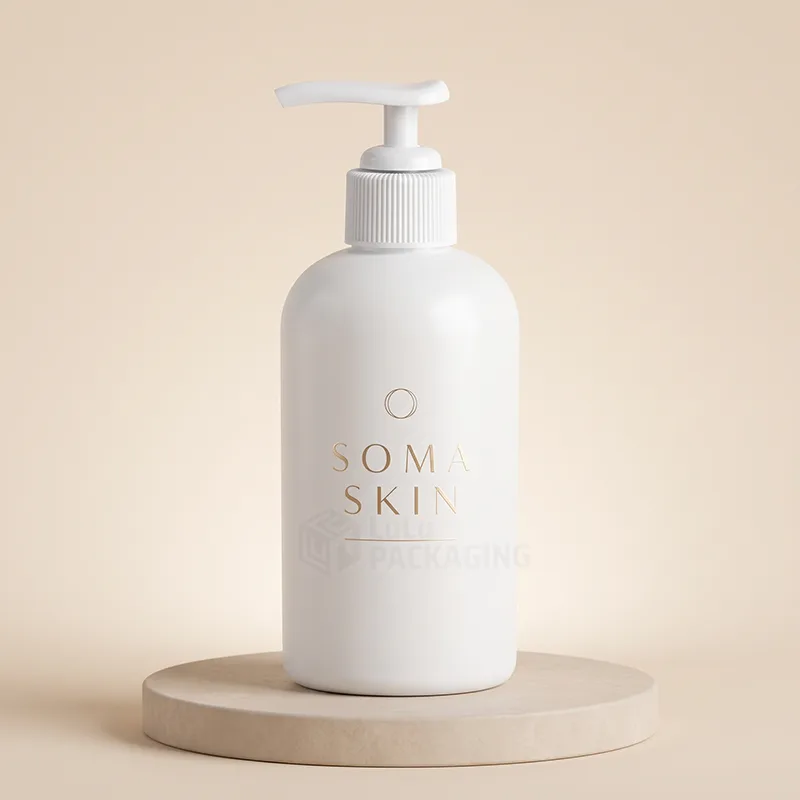 White lotion pump bottle with a white pump and a gold foil logo on a wooden stand
